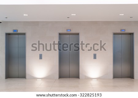 Three lift doors in office building