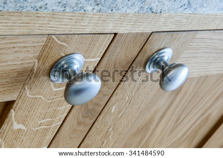 Close up of kitchen cabinet door knobs