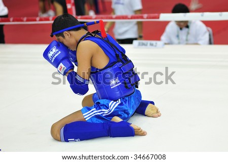 BANGKOK , THAILAND - AUG 2: 1st Asian martial arts games 2009, Thai boxing competition, the first Thai competitor,  Virapong Nonting  performing the traditional wai khru dance on August 2, 2009 in Bangkok, Thailand.