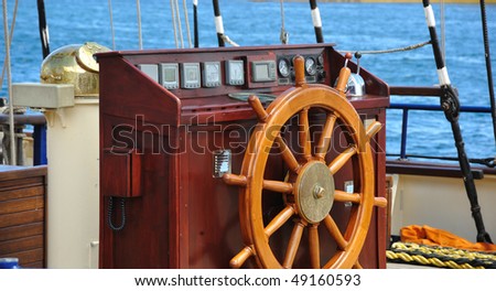 rudder-wheel of an old  wooden ship