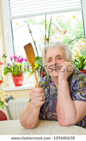 Angry old woman in the kitchen