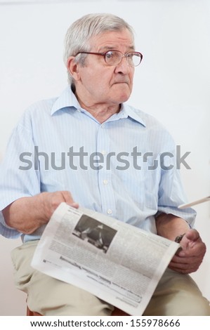 cute old man with newspaper