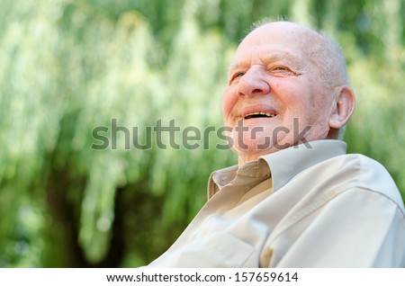 Closeup Profile On A Smiling Old Man