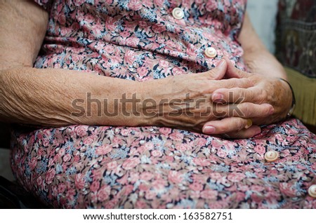 old woman's hands joined together