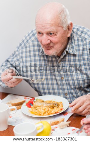 Old man eating a healthy meal