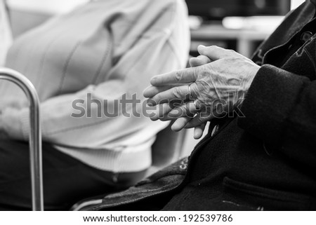 Closeup of an old woman's hands joined