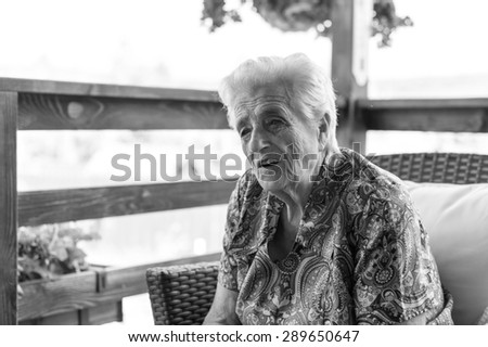 Portrait of a smiling elderly woman - black and white
