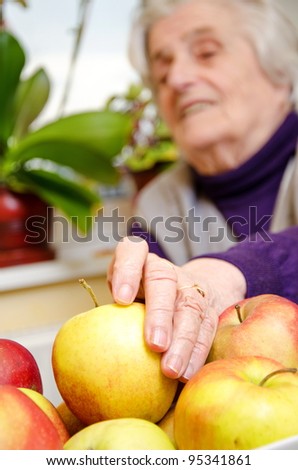 Aged female want to eat  apple