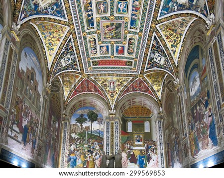 SIENA, ITALY - JULY 27, 2013: Interior of Duomo di Siena or Siena Cathedral.  Piccolomini Library with frescoes painted by Umbrian Bernardino di Betto, called Pinturicchio