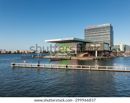 AMSTERDAM, NETHERLANDS - JUNE 6, 2015: Waterfront view with Music Building on the IJ, Bimhuis, Zouthaven restaurant and hotel in Amsterdam City, Netherlands