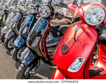HILVERSUM, NETHERLANDS -APRIL 18, 2015: Row of new Italian motorcycles for sale in front of a shop in the Netherlands