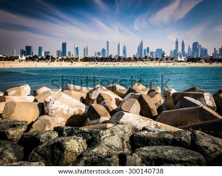 DUBAI, UNITED ARAB EMIRATES (UAE) - JAN 24, 2014: Jumeirah Beach and city skyline of Dubai, United Arab Emirates