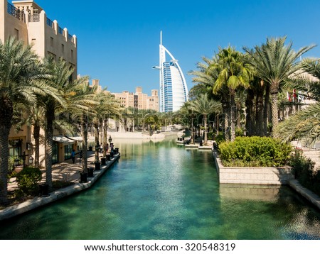 DUBAI, UNITED ARAB EMIRATES - JAN 25, 2014: Madinat Jumeirah Resort and tower of Burj al Arab Hotel in Dubai, United Arab Emirates