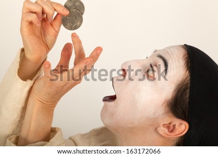 The clown with a purse and coins in his hand