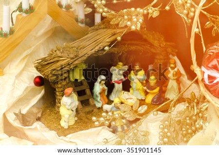 Scene where Virgin Mary has given birth to Jesus and he is laying in cradle surrounded by people who came to celebrate nativity of Christ,horizontal photo