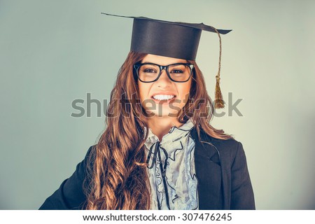 Portrait closeup beautiful happy latina graduate, graduated student girl, young woman in cap gown turning smiling looking at you, camera isolated green background wall. Celebrating graduation ceremony