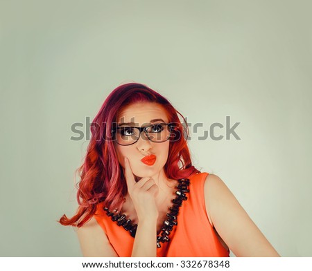 Portrait closeup funny confused skeptical woman girl female thinking with glasses looking up isolated green wall background copy space above head. Human expressions, emotions, feelings, body language