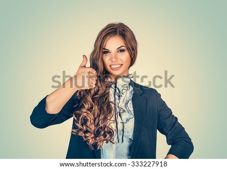 Happy woman giving thumbs up sign - isolated over green background wall. Happy beautiful girl. Positive human emotions, face expression life perception, feelings, body language, attitude perception