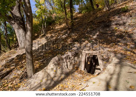 Old abandoned mine entrance in forest