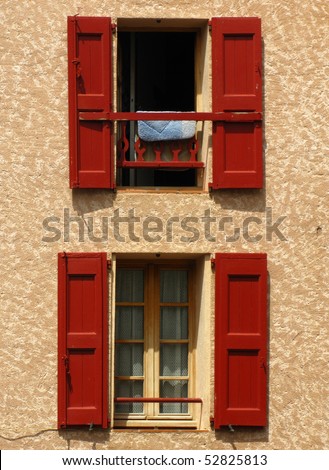 Two windows in the old building in Provence, France