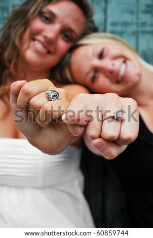 Closer shot of Two Females holding hands forward displaying a pinky promise/Pinky Promise Me