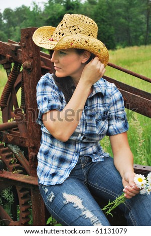 Country girl brushing hair back/Fashionable Cowgirl