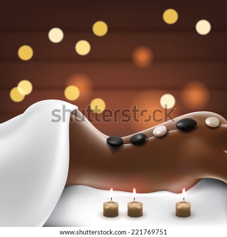 woman in spa salon with hot stone massage