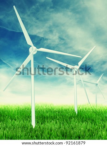Wind farm: Industrial Eolic installation in a green field of grass