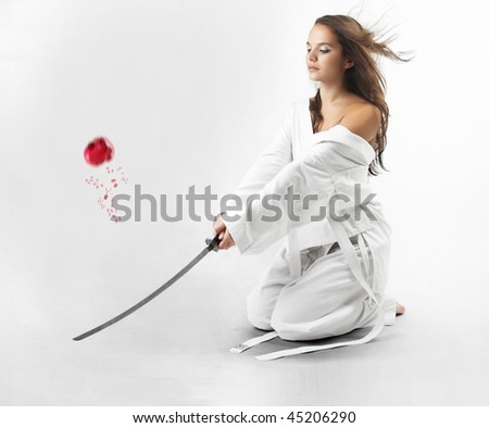 Attractive young sexy women with samurai sword on white background