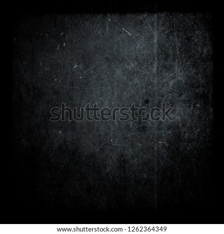 Dark blue scratched scary grunge background, old film effect, distressed texture with black frame, space for your text or picture