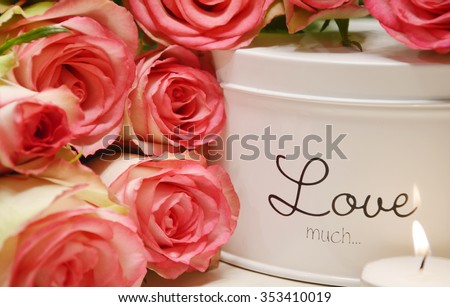Love text with pink roses and candle light  (soft focus,lens blur)