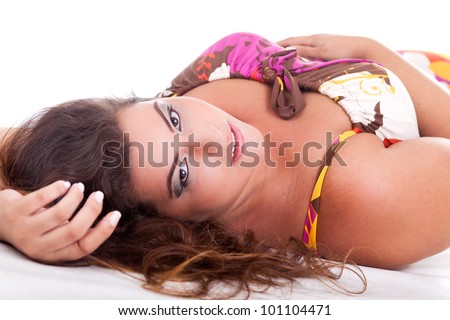 Female Plus size model posing in the studio, face portrait, on white background. The woman is sensual on the floor. Good for concept of health, happiness, dieting, obesity, weight loss.