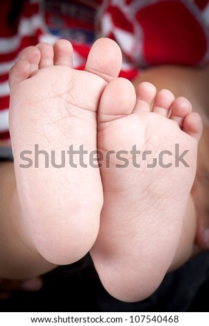 Closeup of baby feet with a candid appeal.