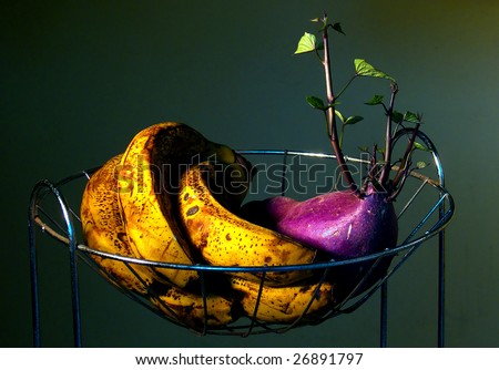 Banana dying and Beet growing a new root, both on a fruit stand
