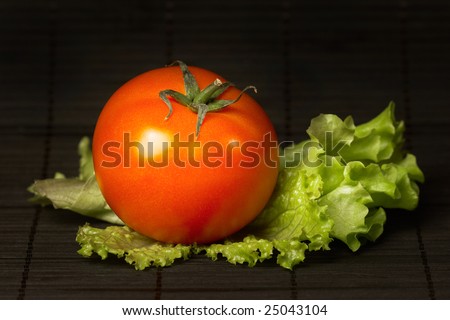 Fresh red tomato and green salad leaf