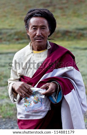 DHO TARAP, NEPAL - SEPTEMBER 11: An unidentified Tibetan man during the local Dho Tarap Full Moon Festival on September 11, 2011 in Dho Tarap Village, Dolpo district, Nepal