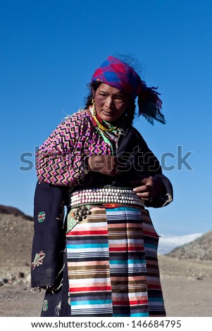 NGARI PREFECTURE, TIBET - MAY 07:  Unidentified Tibetan woman on the Kora trail around sacred mount Kailash on May 07, 2013 in Ngari Prefecture, Tibet Autonomus Region of China