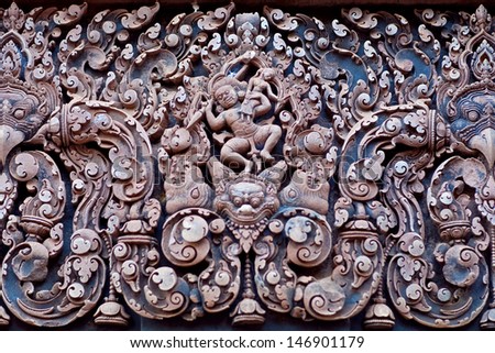 CAMBODIA - JANUARY 05: Ancient bas-relief at the facade of Banteay Srey Temple on January 05, 2013 in Angkor Area, Cambodia. Banteay Srey is a 10th century Cambodian temple dedicated to the God Shiva