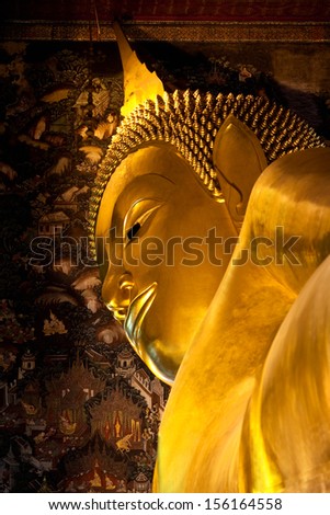 BANGKOK, THAILAND - JANUARY 28: The Big golden Reclining Buddha at Wat Pho on January 28, 2011 in Bangkok, Thailand. The image of reclining Buddha is 15 m high and 43 m long.