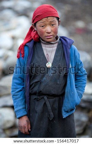 LHO - NOVEMBER 29: Tibetan girl Pema Dorchi, age 13, from the village of refugees poses for a photo on November 29, 2009 in Lho Village, Gorkha District, Nepal