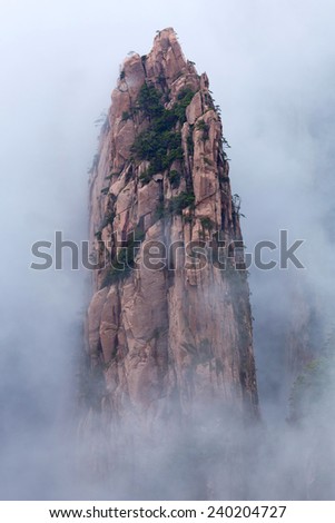 Lone rock over mist in Huangshan Mountain (Yellow Mountain), China. Of all the notable mountains in China, it is probably the most famous to be found in the south of Anhui province.