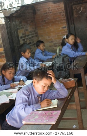 KATHMANDU, NEPAL - MAY 8: Nepalese students read aloud in the elementary school in Kathmandu, Nepal, on May 8, 2008. Study shows that the government spent 2.3% of GDP on education expenditure.