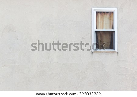 Empty wall with small window Detail of house exterior wall.