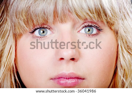 pretty young girl\'s face close-up, regular and thin facial features