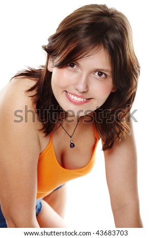 Striking brunette in yellow T-shirt leaned over and bared a beautiful neck, smiling posing on a white background