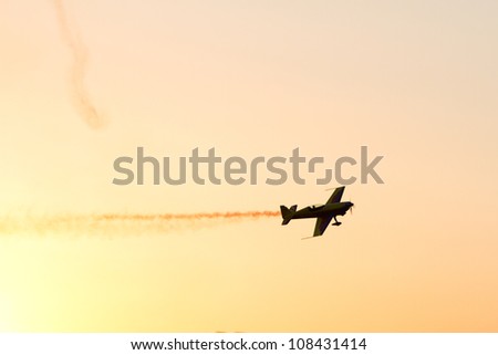 BUCHAREST - JULY 21: Evening Air Performance by Romanian Air-club at Bucharest International Air Show & General Aviation Exhibition (BIAS 2012) on July 21, 2012 in Bucharest, Romania