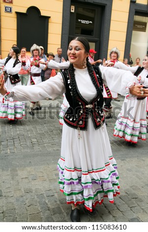 PRAGUE - AUGUST 26: Unknown people dance in traditional Russian costumes at Folklore Festival Prague Fair, 25-30.8.2009, close to the Old Town Square on August 26, 2009 in Prague, Czech Republic
