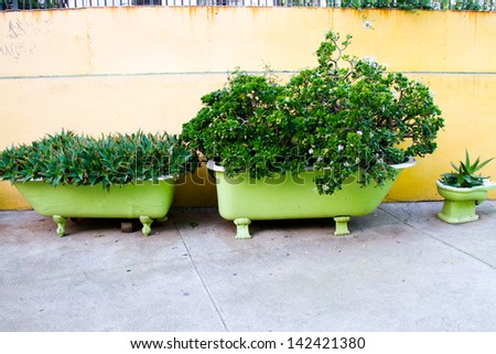 VALPARAISO - JUNE 09: Recycled bathtub and toiled as flower pots in  Concepcion and Alegre districts of the protected UNESCO World Heritage Site of Valparaiso on June 9, 2013 in Valparaiso, Chile