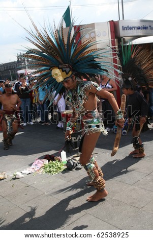 MEXICO CITY - JULY 28: Parade participants execute Amerindian rituals in the square in front of Mexico City Cathedral and Metropolitan Tabernacle, Mexico City, Mexico, on 28 July 2010.