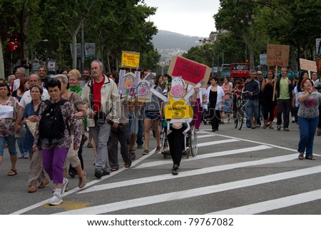 BARCELONA - JUNE 19: Unidentified people protest against unemployment and political corruption, continuing the ones started by 15-M Movement, on June 19, 2011 in Plaça Catalunya, Barcelona, Spain